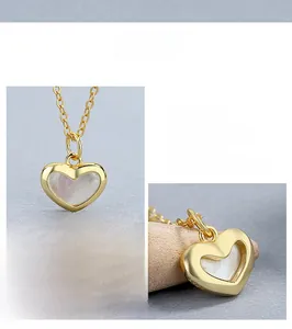 Close-up of S925 sterling silver gold heart necklace with white mother of pearl inlay