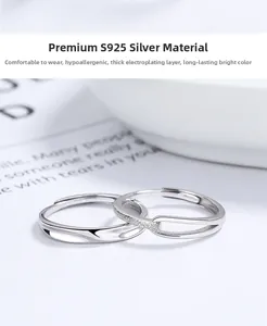 Close-up of S925 sterling silver couple rings with matte hollow and twisted rope textures