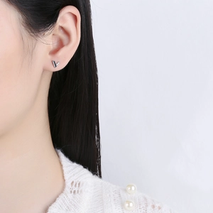 Asymmetric V-shaped 925 silver stud earrings with black enamel and zircon inlay