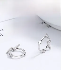Detailed macro view of S925 sterling silver hallmark on lightning-shaped earrings