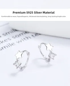 Detail of S925 silver star earrings with round cubic zirconia and thick plating finish