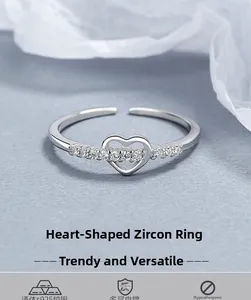 Macro shot of S925 sterling silver ring featuring a hollow heart set with cubic zirconia