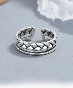 Detail of 925 sterling silver double-layer ring with vintage twisted rope texture