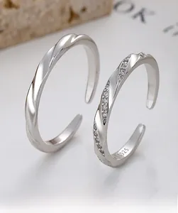 Macro shot of 925 sterling silver Mobius rings with adjustable band and inlaid stones