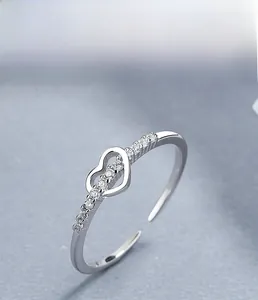 Macro shot of S925 sterling silver heart ring with micro-pave cubic zirconia details
