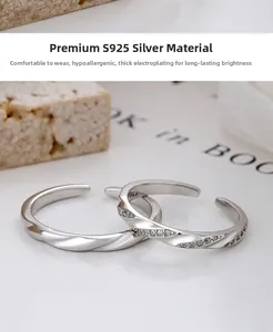Detailed macro shot of 925 sterling silver Mobius rings with polished finish and cubic zirconia
