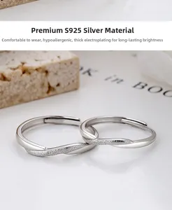 Close-up of 925 sterling silver couple rings featuring matte finish and adjustable bands