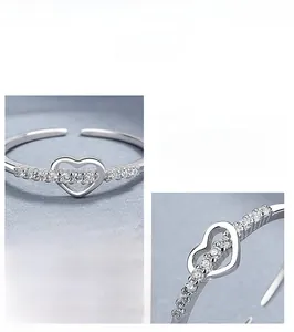 Detailed close-up of S925 sterling silver heart ring with shimmering zircon stones
