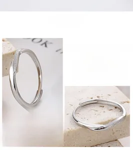 Detail view of adjustable S925 sterling silver ring with frosted and polished texture