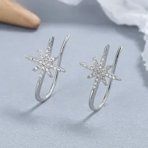 Macro shot of 925 sterling silver starburst earrings with sparkling cubic zirconia stones
