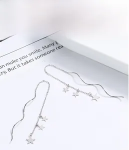 Detail of S925 sterling silver star tassel earrings with wavy ear wire and chain