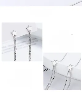 Detailed macro view of 925 sterling silver star-shaped tassel earrings with polished finish