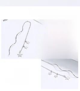 Macro detail of 925 sterling silver star fringe earrings with polished tassel design
