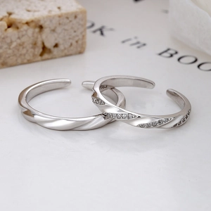 925 silver Mobius couple rings with sparkling zircon stones in an adjustable open design