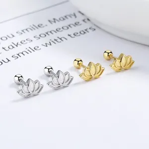 Detailed close-up of lotus stud earrings with matte texture in silver and gold finish