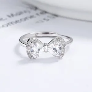 Macro shot of 925 sterling silver bow ring featuring heart-shaped cubic zirconia crystals