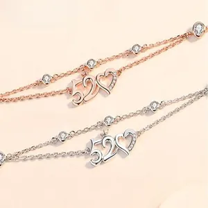 Macro detail of 925 silver 520 heart charms in rose gold and silver with pave zircon
