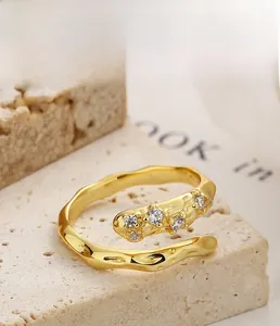 Macro detail of S925 silver ring with 18K gold plating and sparkling zircon stones