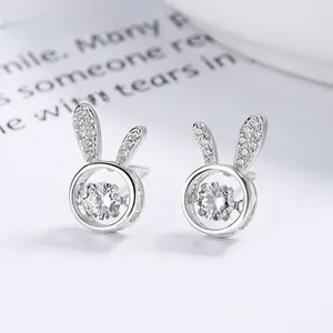 Macro shot of 925 sterling silver rabbit stud earrings with dancing cubic zirconia