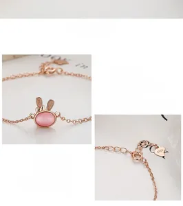 Detail of rose gold bunny bracelet with pink cat eye stone and S925 silver tag