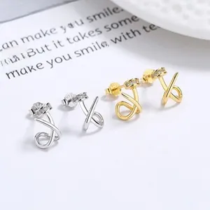 Macro shot of S925 sterling silver twisted stud earrings with inlaid zircon details