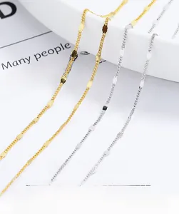 Detailed close-up of 925 sterling silver beaded chain necklace on a minimalist book background
