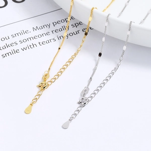 S925 sterling silver beaded choker necklace in gold and silver finishes on white tray