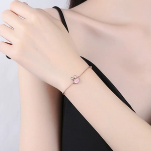 925 silver cute rabbit bracelet in rose gold with pink gemstone on woman's wrist