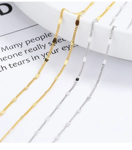 Detailed close-up of 925 sterling silver ball chain necklace in gold and silver finishes