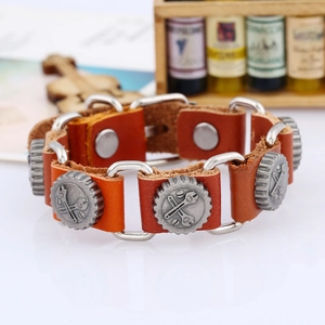 Detail of a brown leather punk bracelet with gear ornaments and wrench relief design