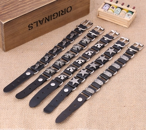 Set of five punk style black leather bracelets featuring metal bats and rivets charms