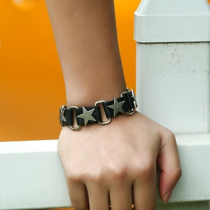 Men's punk leather bracelet with silver star accents shown on a wrist for street style
