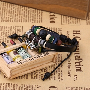 Handmade beaded leather wrap bracelet with dragonfly charm and colorful wooden beads