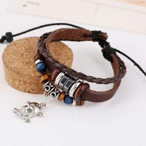 Multilayer brown leather beaded bracelet with skull charm and adjustable closure