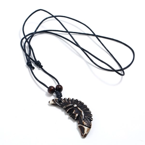 Vintage ethnic tribal resin pendant necklace with feather headgear and black wax rope