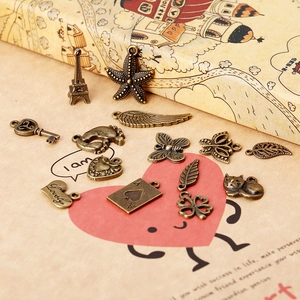 Assorted antique bronze metal charms including Eiffel Tower and heart for DIY jewelry making