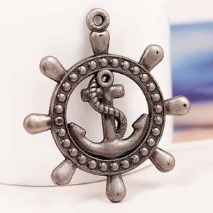 Vintage silver anchor and helm pendant made of alloy with nautical rope detailing