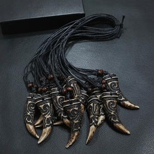 Tribal style wolf tooth resin pendant necklace with wax cord and brown wood beads