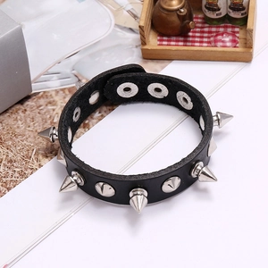 Punk leather bracelet with silver metal spikes and adjustable buckle on white background
