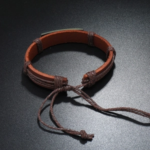 Handmade vintage brown leather bracelet for men with adjustable cord and metal plate