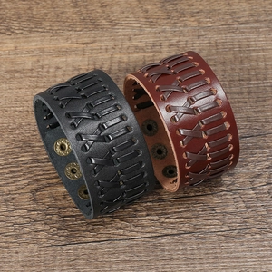 Handmade woven leather bracelet set with vintage cross-stitch and adjustable snap buttons