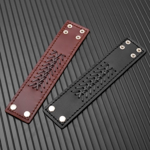 Macro detail of retro woven leather bracelets with silver snaps in black and dark brown