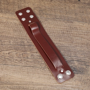 Macro view of wide dark brown genuine leather men's bracelet with silver snap buttons