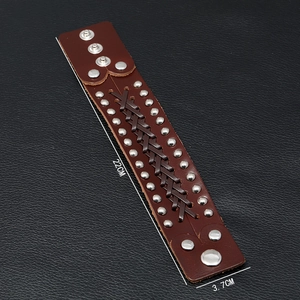 Brown braided leather wide cuff bracelet with silver rivets and adjustable snap buttons