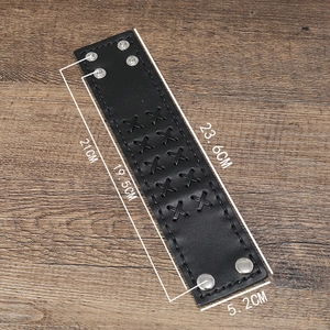 Close-up of vintage wide leather bracelet for men with cross stitching and snap buttons