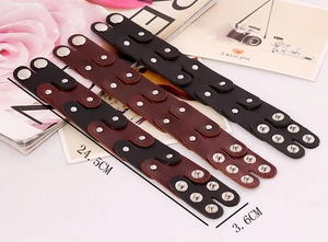 Detailed view of punk leather bracelet layers with dual snap buttons and 24.5cm size mark