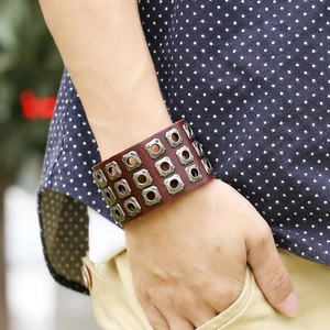 Retro punk genuine leather bracelet with three rows of silver square studs on a wrist