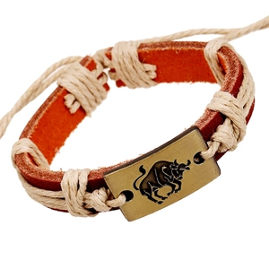 Vintage Taurus leather bracelet with bronze metal charm and braided hemp rope accents