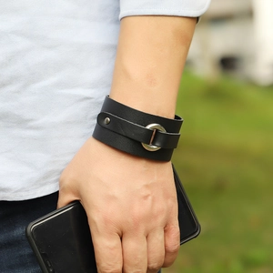 Retro mens black wide leather bracelet with silver metal ring and minimalist punk style