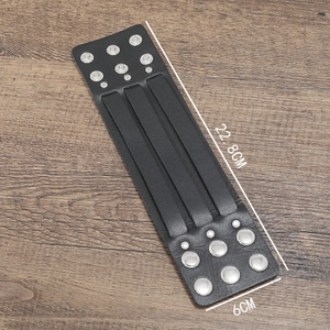 Detail shot of black multi-layer leather bracelet with size dimensions on wood background